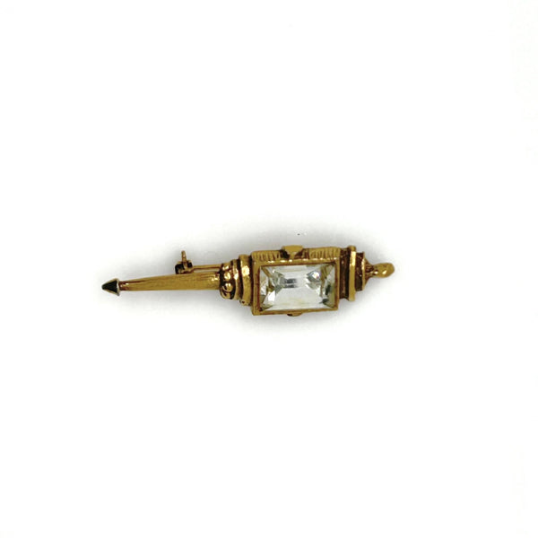 Signed Goldette vintage Victorian Revival gold-tone lantern brooch pin with an emerald-cut clear glass rhinestone
