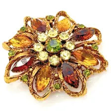 1950s Austrian costume jewelry flower pin with multi-colored faceted crystals and olivine rhinestone center