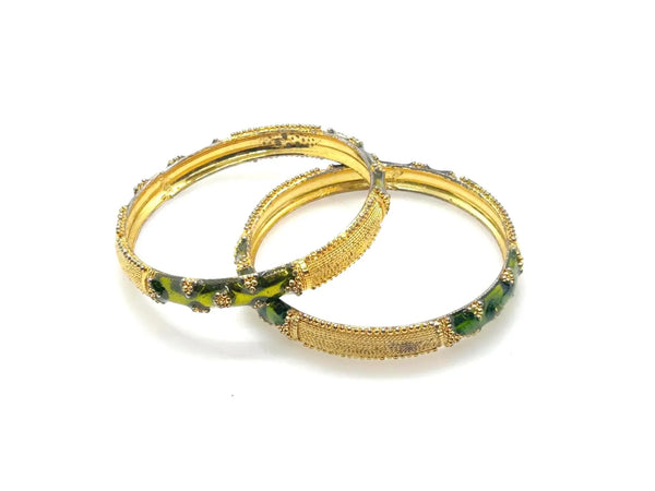 A pair of traditional Indian gold-plated bangles showcasing intricate filigree work and vibrant grass green enamel detailing.