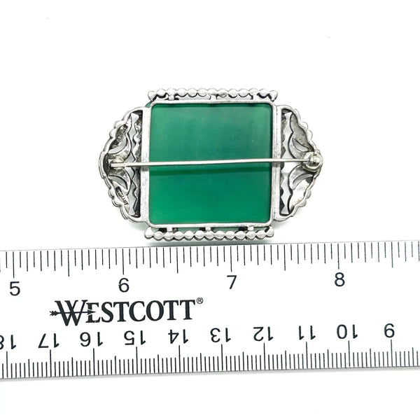 Perfect for vintage jewelry lovers: our Green Square Stone pin provides timeless elegance with a marcasite-studded vintage brooch design. Shop today!