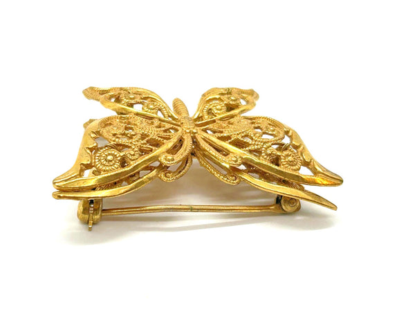 Vintage Miriam Haskell jewelry collection: A signed Russian gold-plated filigree butterfly pin from the 1950s with detailed openwork wings.