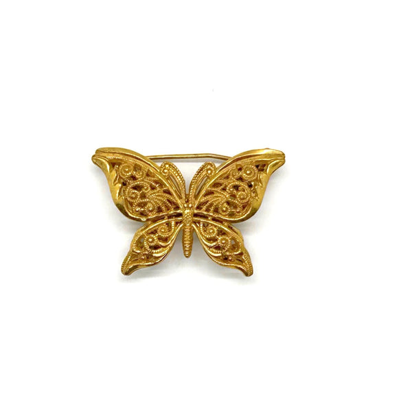 Vintage Miriam Haskell jewelry collection: A signed Russian gold-plated filigree butterfly pin from the 1950s with detailed openwork wings.