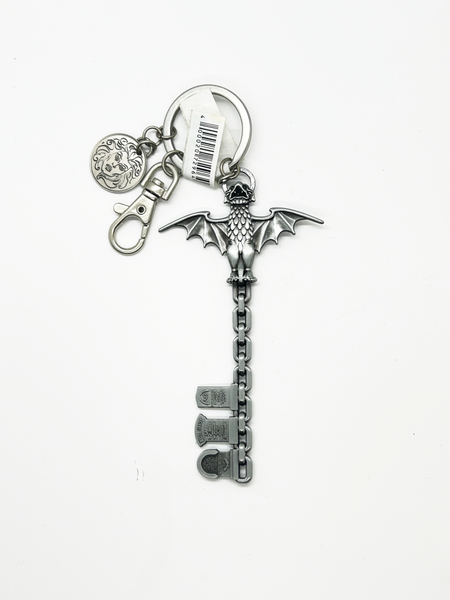 Silver keychain with a bat design on a white background