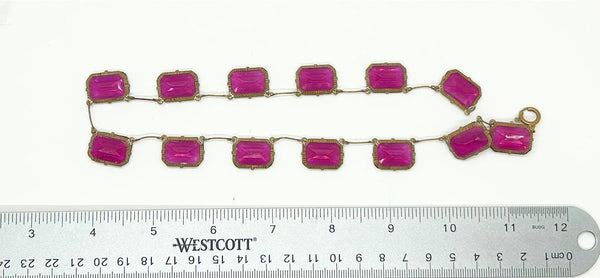 Admire the timeless beauty of our Graceful Vintage Czech Violet Clear Stones Necklace. Handcrafted with thirteen emerald cut purple clear stones encased in intricately detailed frames, this elegant necklace is a true work of art. With a length of approximately 15", it is a delicate and sophisticated addition to any outfit. Experience luxury and exclusivity with this exquisite piece, in very good vintage condition. Free Shipping