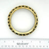 This exquisite vintage bangle bracelet is a captivating piece, showcasing the artistry of three meticulously crafted brass braids elegantly set upon a substantial, weighty metal base. The enchanting golden finish, combined with a perfect 1" vertical height, ensures this bracelet is not only visually stunning but also remarkably versatile, beautifully complementing a wide array of wrist sizes