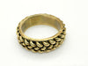 This exquisite vintage bangle bracelet is a captivating piece, showcasing the artistry of three meticulously crafted brass braids elegantly set upon a substantial, weighty metal base. The enchanting golden finish, combined with a perfect 1" vertical height, ensures this bracelet is not only visually stunning but also remarkably versatile, beautifully complementing a wide array of wrist sizes