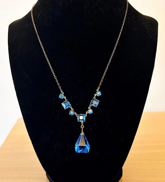 Perfect for jewelry lovers: our Vintage Art Deco Drop Blue Glass Necklace provides a beautiful blue drop design with premium heritage craftsmanship. Shop today!