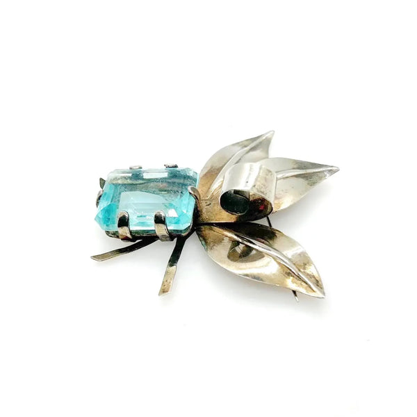 Perfect for vintage lovers: our Dramatic Vintage Sterling Floral Brooch with Large Aqua Stone provides bold elegance and timeless charm. Shop today!