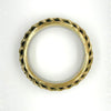 This exquisite vintage bangle bracelet is a captivating piece, showcasing the artistry of three meticulously crafted brass braids elegantly set upon a substantial, weighty metal base. The enchanting golden finish, combined with a perfect 1" vertical height, ensures this bracelet is not only visually stunning but also remarkably versatile, beautifully complementing a wide array of wrist sizes