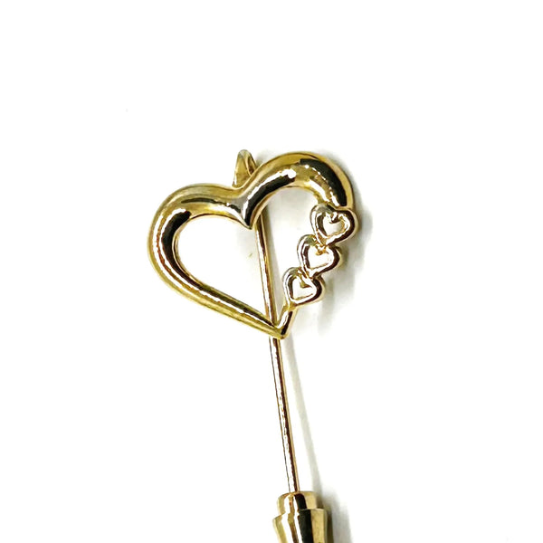 This sweet retro heart stick pin is so charming! It has an openwork design with three smaller hearts along the side. These pins were super popular in the 70s and 80s, perfect for sweaters, blazers, or even scarves. It's 1.5" long and in great shape!