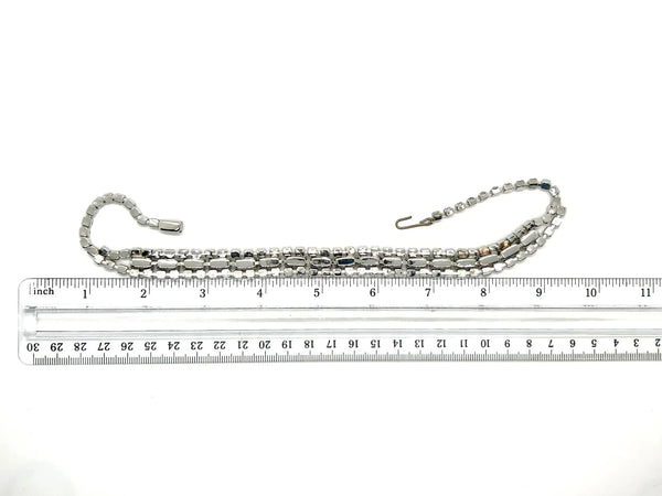 This is a beautiful vintage rhinestone necklace or choker set with a line of sideways baguettes in black paired with meticulously prong-set round white rhinestones on top and bottom.