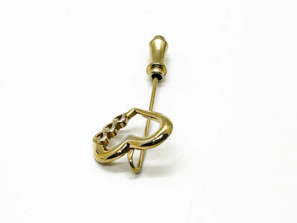 This sweet retro heart stick pin is so charming! It has an openwork design with three smaller hearts along the side. These pins were super popular in the 70s and 80s, perfect for sweaters, blazers, or even scarves. It's 1.5" long and in great shape!