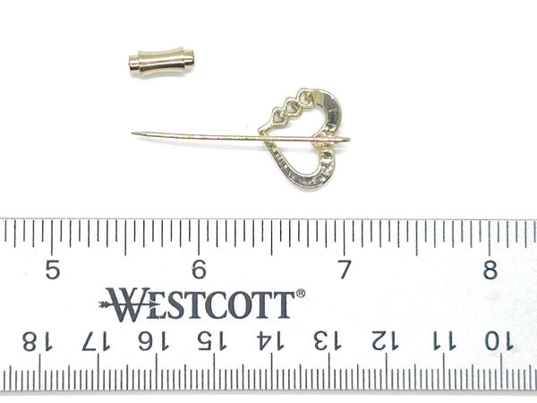 This sweet retro heart stick pin is so charming! It has an openwork design with three smaller hearts along the side. These pins were super popular in the 70s and 80s, perfect for sweaters, blazers, or even scarves. It's 1.5" long and in great shape!