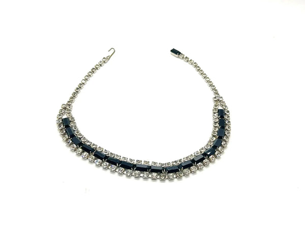 This is a beautiful vintage rhinestone necklace or choker set with a line of sideways baguettes in black paired with meticulously prong-set round white rhinestones on top and bottom.