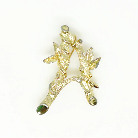 Sarah Coventry Initial "A" Vintage Brooch (1964) - Showcase timeless style with this gold-toned bamboo-look initial brooch. Signed SarahCov and measures 2". Shop now!