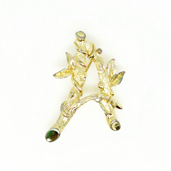Sarah Coventry Initial "A" Vintage Brooch (1964) - Showcase timeless style with this gold-toned bamboo-look initial brooch. Signed SarahCov and measures 2". Shop now!