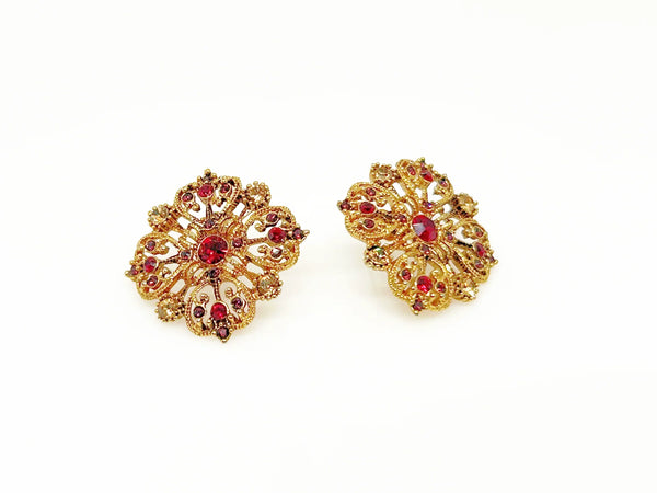 These filigreed vintage red earrings offer an exquisite aesthetic, beautifully detailed with pink, purple, and red chaton rhinestones in a square pattern. Meticulously designed, each earring's dimensions measure 3/4" square. 