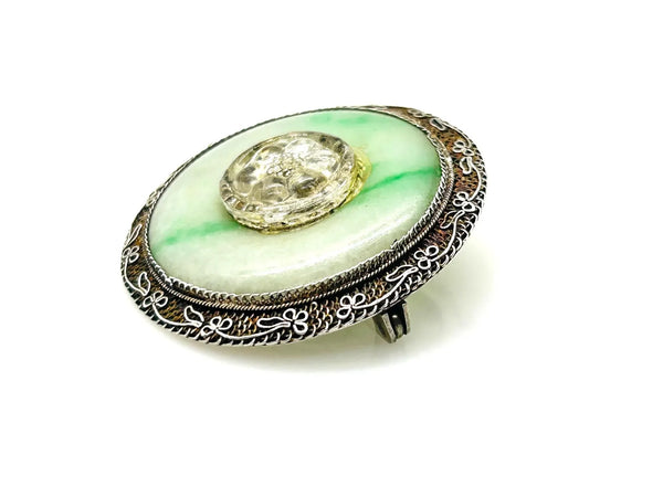 The shades of this vintage Chinese sterling silver and jade filigree brooch are perfect for spring and summer.
