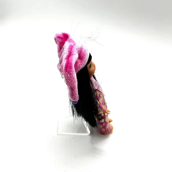 Jester Jenny doll wearing a pink and white checkered outfit with a matching hat on a white background