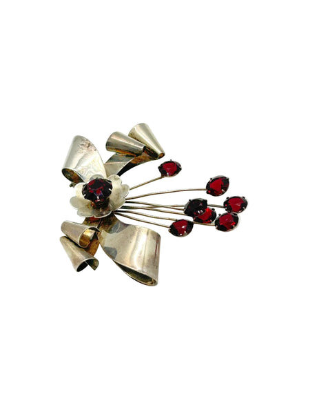 Perfect for vintage jewelry lovers: our Sterling by Jordan 1940s Red Stone Vintage Bow Brooch provides timeless elegance with striking red stones. Shop today!
