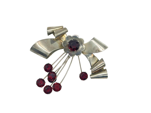 Perfect for vintage jewelry lovers: our Sterling by Jordan 1940s Red Stone Vintage Bow Brooch provides timeless elegance with striking red stones. Shop today!