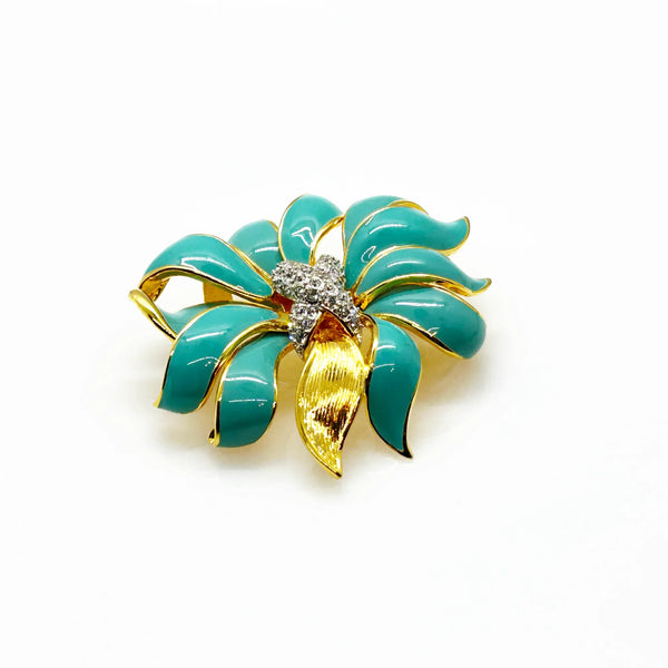 Perfect for vintage jewelry collectors: our KJL Fleur Moderne Brooch provides bold turquoise enamel and sparkling rhinestone glamour. Shop today!