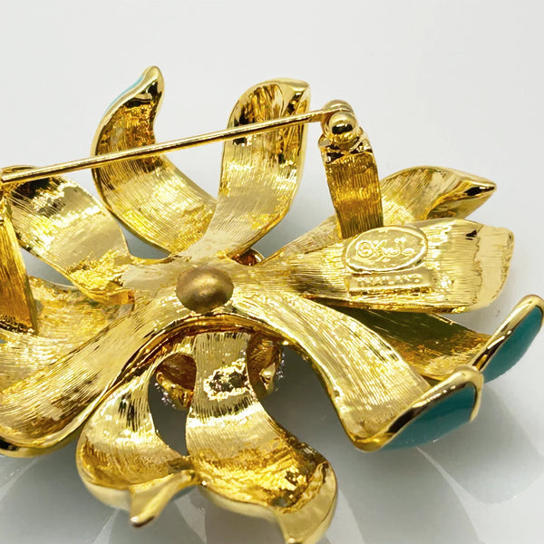 Perfect for vintage jewelry collectors: our KJL Fleur Moderne Brooch provides bold turquoise enamel and sparkling rhinestone glamour. Shop today!