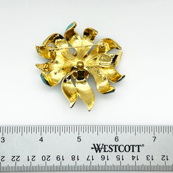 Perfect for vintage jewelry collectors: our KJL Fleur Moderne Brooch provides bold turquoise enamel and sparkling rhinestone glamour. Shop today!