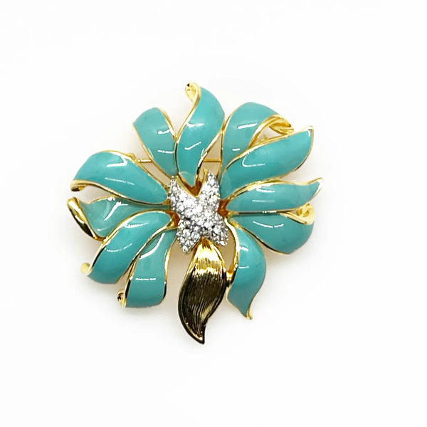 Perfect for vintage jewelry collectors: our KJL Fleur Moderne Brooch provides bold turquoise enamel and sparkling rhinestone glamour. Shop today!