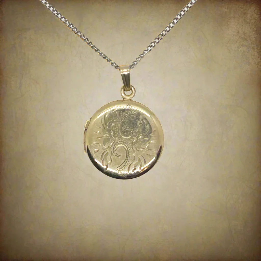This timeless piece from the late 1960s features carefully engraved detailing on the front and a sleek, polished back. The locket has enough space for two treasured photos or any other keepsake of your choice.