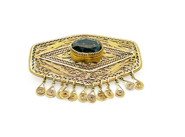 Vintage Israel Filigree Brooch/pendant with Tassels and Smokey Quartz center Stone.It has a geometric shape with tiny filigree drops at the bottom, and a large, faceted oval stone is the centerpiece. The metal is extremely intricate and detailed, both front and back.