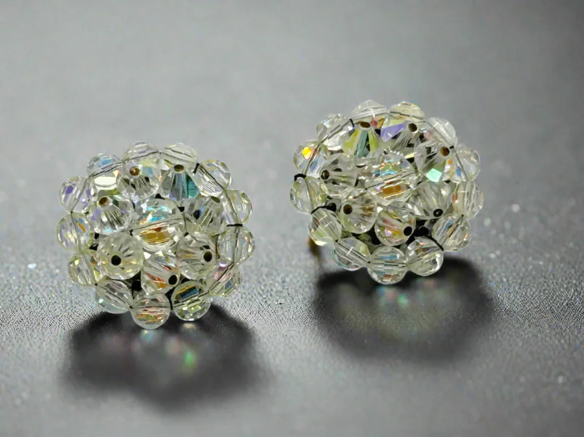 These vintage earrings are so bright and sparkling that it's hard to capture. They retain all of the colorful reflections of light despite the passage of time. There are three layers of hand wired round bead, and from every angle, there is sparkle
