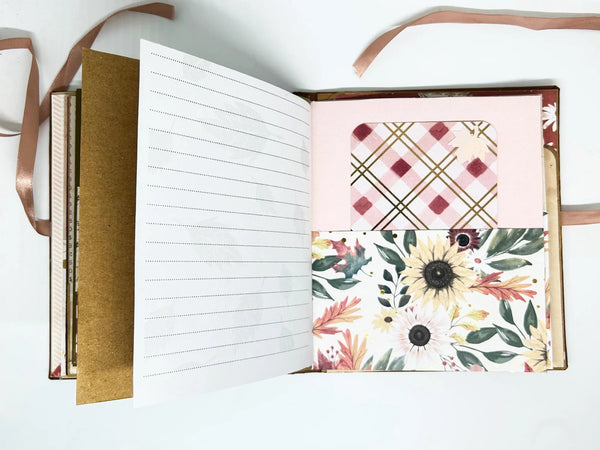This charming album showcases autumn leaves, seasonal flowers, and delightful illustrations of warm drinks. Centered around family, home, fall, and coffee, it includes dedicated spaces for your personal notes and mementos, allowing you to customize it easily.