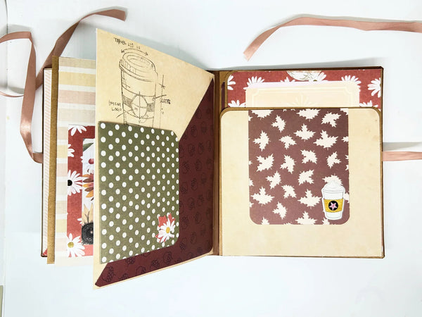 This charming album showcases autumn leaves, seasonal flowers, and delightful illustrations of warm drinks. Centered around family, home, fall, and coffee, it includes dedicated spaces for your personal notes and mementos, allowing you to customize it easily.