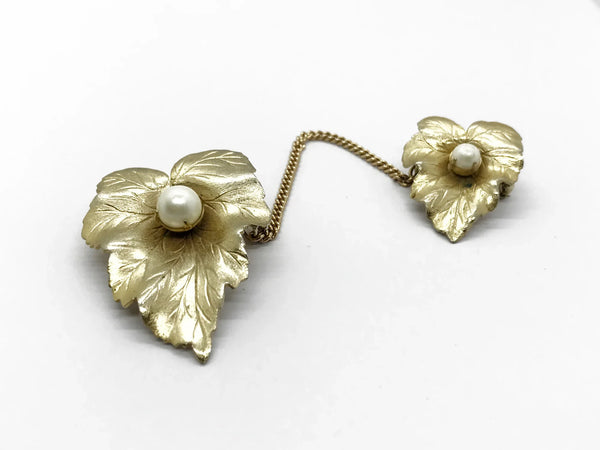 Discover the charm of mid-century elegance with this authentic pair of&nbsp; Sarah Coventry "Chit-Chat" sweater guards from the late 1950s.