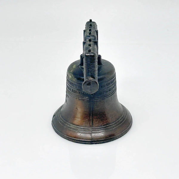 Bring a touch of American history to your home with this charming, miniature metal replica of the iconic Liberty Bell. Standing at a delightful 2.5 inches tall, this piece beautifully captures the essence of freedom and independence, a symbol that has resonated since the American Revolution.