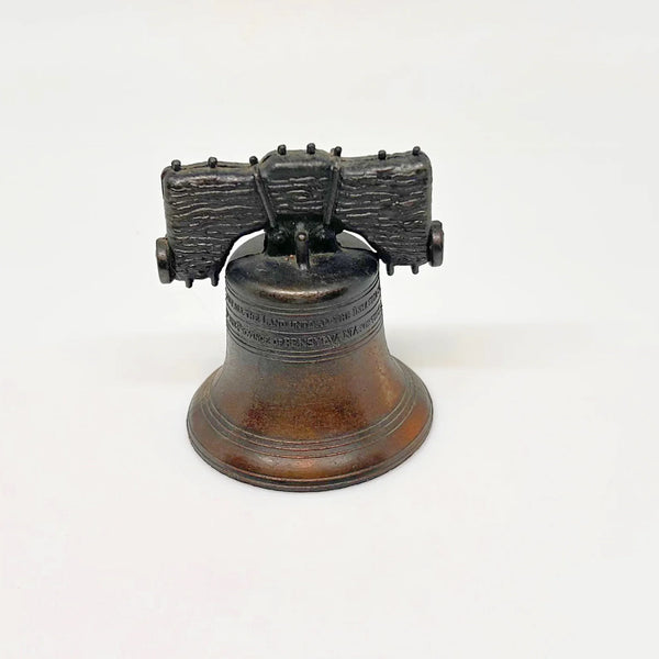 Bring a touch of American history to your home with this charming, miniature metal replica of the iconic Liberty Bell. Standing at a delightful 2.5 inches tall, this piece beautifully captures the essence of freedom and independence, a symbol that has resonated since the American Revolution.
