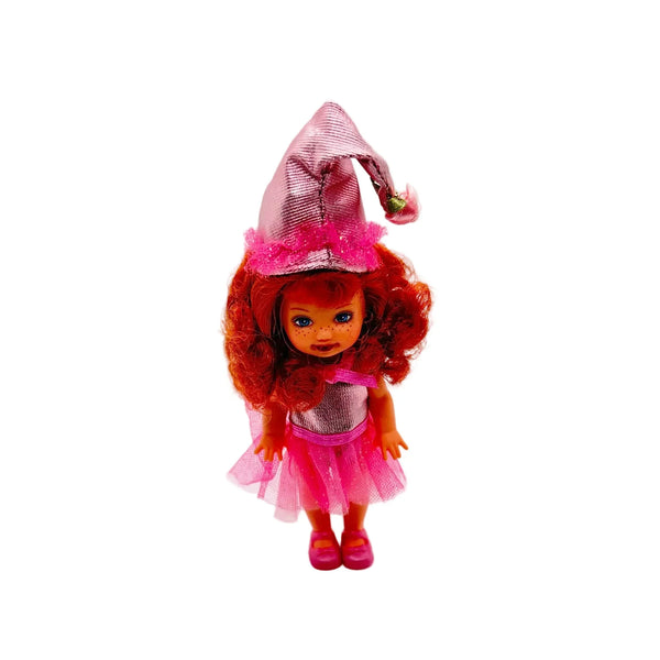 Kelly appears as Lullaby Munchkin doll from The Wizard of Oz collection. This charming figure dressed as the iconic Lullaby Munchkin character.