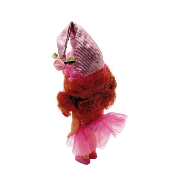 Kelly appears as Lullaby Munchkin doll from The Wizard of Oz collection. This charming figure dressed as the iconic Lullaby Munchkin character.