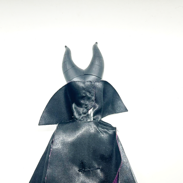 Disney Store Maleficent 12-inch classic fashion doll wearing her iconic black and burgundy robe with curved horns headpiece, isolated on a solid white background.