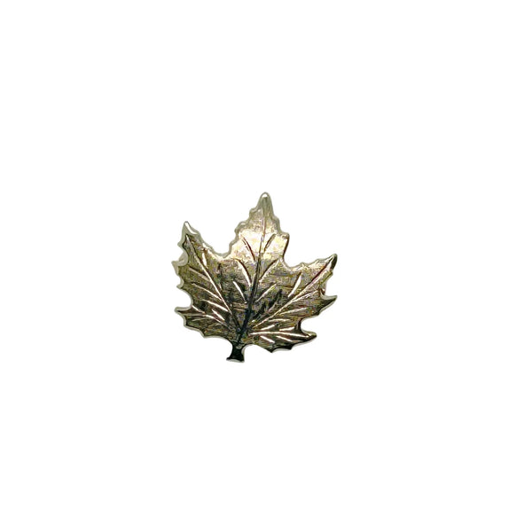 Add a touch of vintage charm to your wardrobe with this delightful silver maple leaf pin! This little beauty- measuring just 1" across- showcases intricate etching that brings the iconic leaf to life, complete with a textured finish that catches the light beautifully.