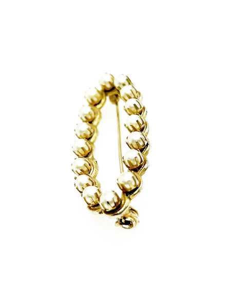 Perfect for fashion enthusiasts seeking subtle sophistication: our elegant vintage marquise shaped faux pearl brooch provides timeless charm and grace. Shop today!