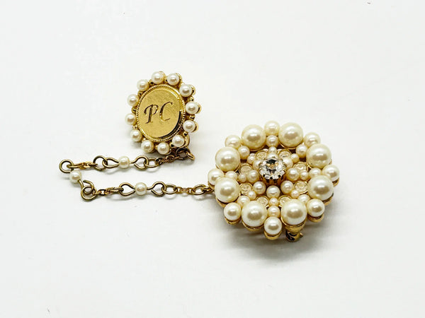 Celebrate timeless elegance with this prestigious Avon Presidents Club brooch set from 1999—a coveted award given to top-performing sales representatives. This stunning two-piece ensemble features lustrous faux pearls in graduated sizes and sparkling clear rhinestones set in warm gold-tone metal. 