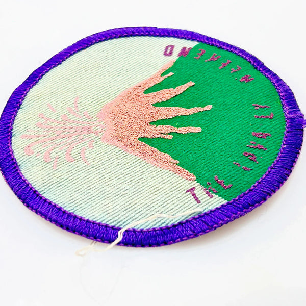 Commemorate a pivotal moment in natural history with this authentic Girl Scout Mount St. Helens patch from the early 1980s. Created in the wake of the volcano's catastrophic 1980 eruption, this Junior Girl Scout badge captures the dramatic geological event through embroidery—a volcano erupting in shades of pink against a serene blue-green sky.