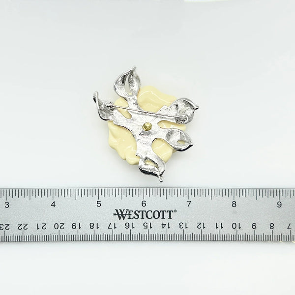 Perfect for those seeking timeless glamour: our Nolan Miller Lara Luscious Camellia Brooch provides exquisite elegance & bold statement style. Shop today!