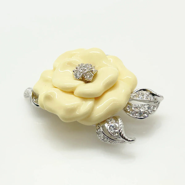 Perfect for those who appreciate timeless glamour: our Nolan Miller Lara Camellia Brooch provides a creamy flower brooch with sparkling elegance. Shop today!