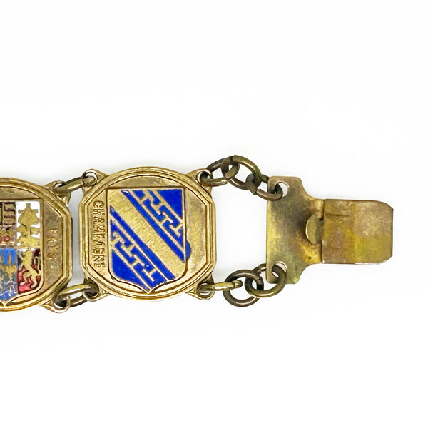 Perfect for vintage jewelry lovers: our Vintage French Souvenir Panel Bracelet provides a stunning display of French heraldic crests. Shop today!
