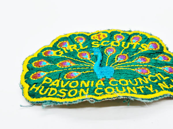 Celebrate Girl Scout heritage with this authentic vintage Pavonia Council patch from Hudson County, New Jersey. The striking peacock design served as the council's proud symbol, representing the organization's values and spirit. 