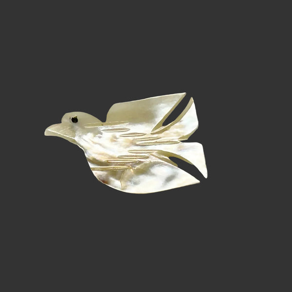Perfect for vintage jewelry lovers: our Hand Carved Vintage Mother of Pearl Peace Dove Pin- 1960s provides a timeless symbol of peace. Shop today!