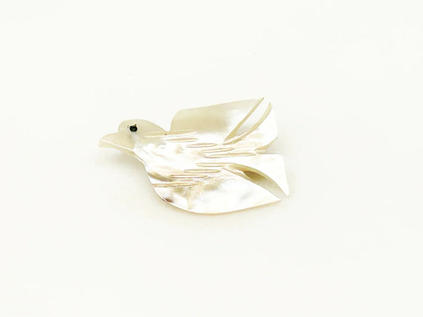Perfect for vintage jewelry lovers: our Hand Carved Vintage Mother of Pearl Peace Dove Pin- 1960s provides a timeless symbol of peace. Shop today!